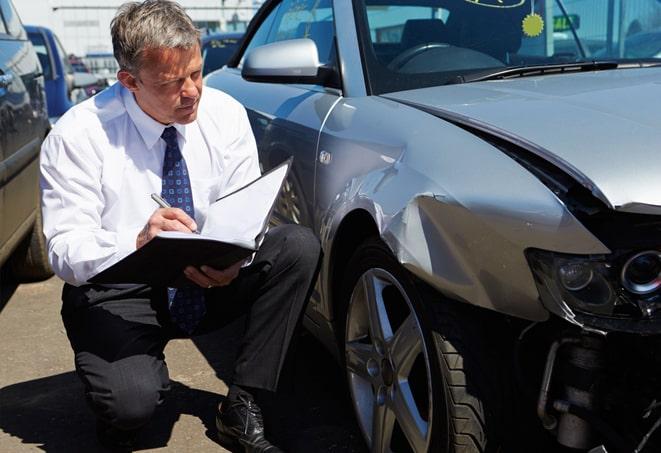 group of people discussing the importance of having auto insurance